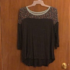 Floral and striped blouse.